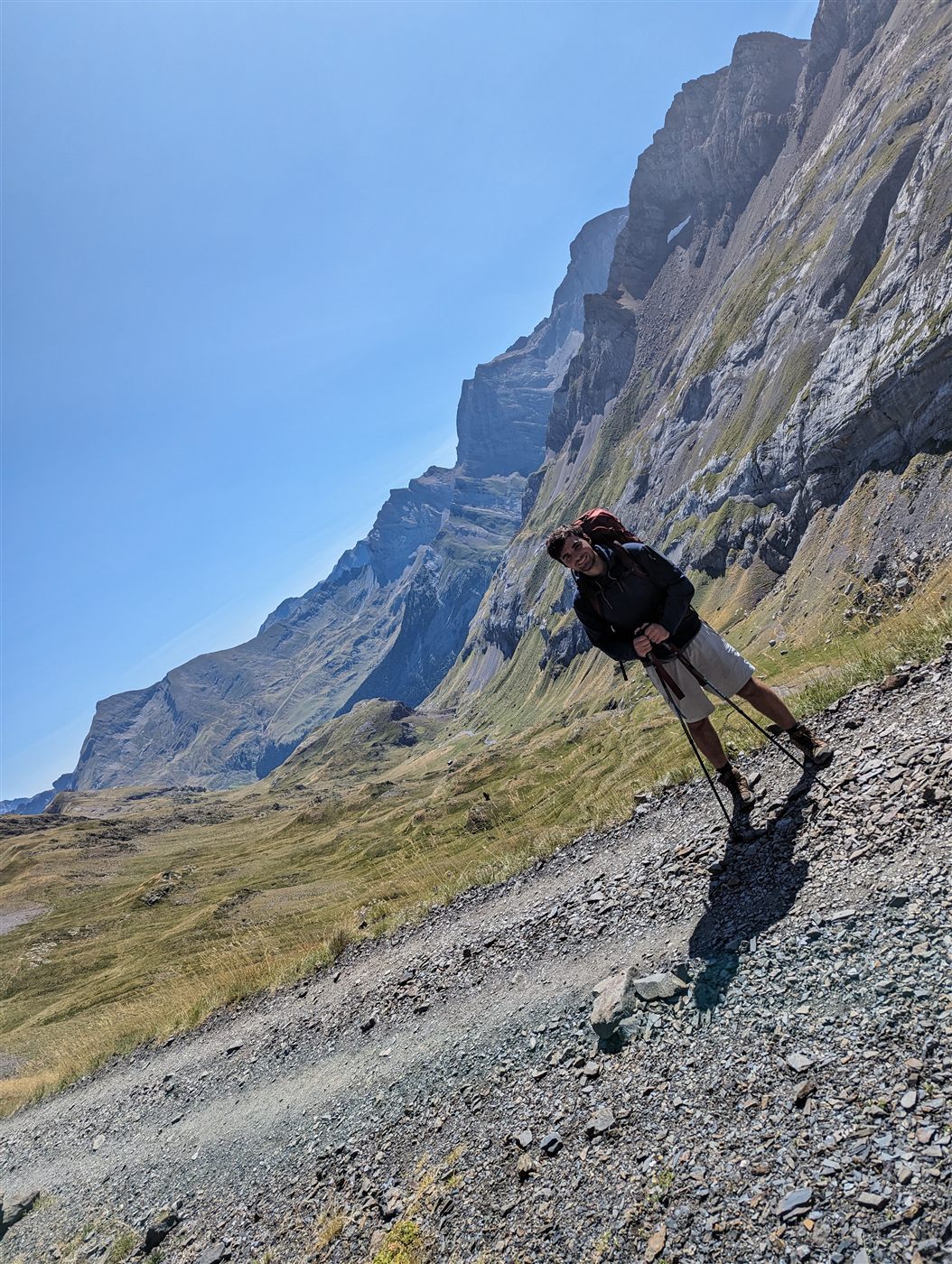 Bret Kiefer backpacking on a mountain trail in the Pyrenees